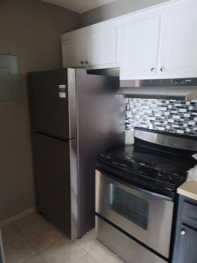 kitchen featuring decorative backsplash, electric panel, white cabinetry, stainless steel appliances, and ventilation hood