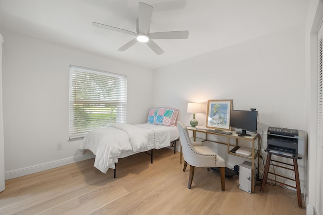 bedroom featuring ceiling fan and light wood-type flooring