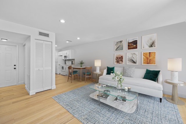 living room with light hardwood / wood-style floors