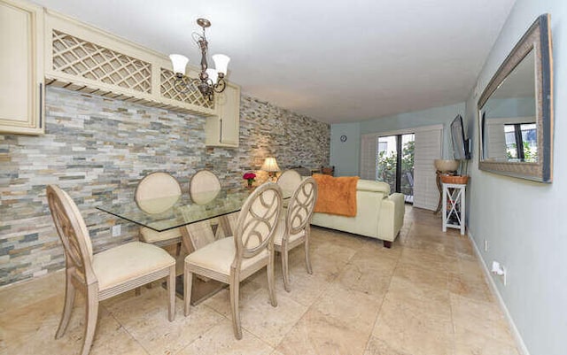 dining area featuring a chandelier