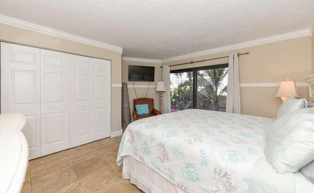 bedroom with ornamental molding and a closet