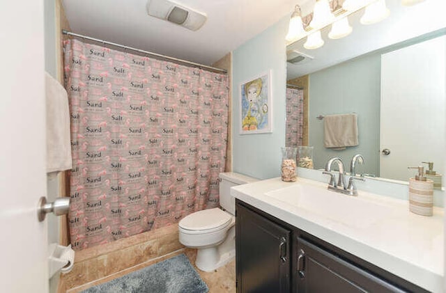 bathroom with vanity, curtained shower, and toilet