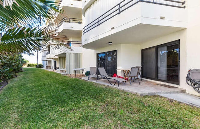 exterior space with a lawn and a patio