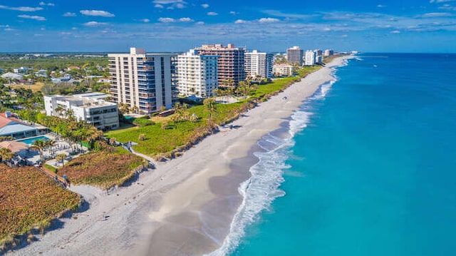 aerial view featuring a water view and a beach view