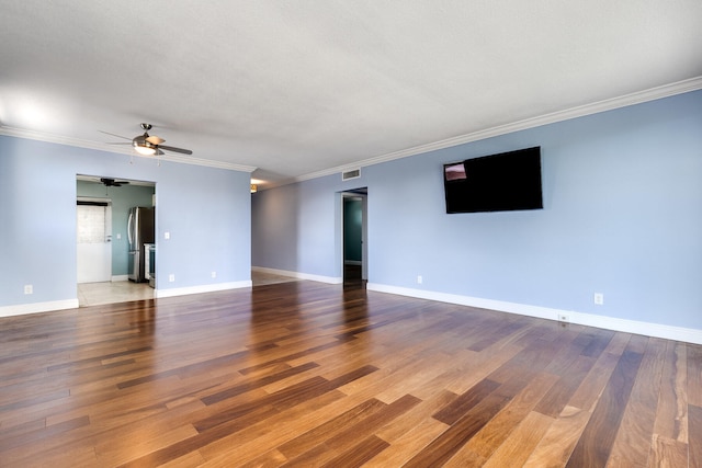 empty room with ceiling fan, ornamental molding, a textured ceiling, and hardwood / wood-style floors