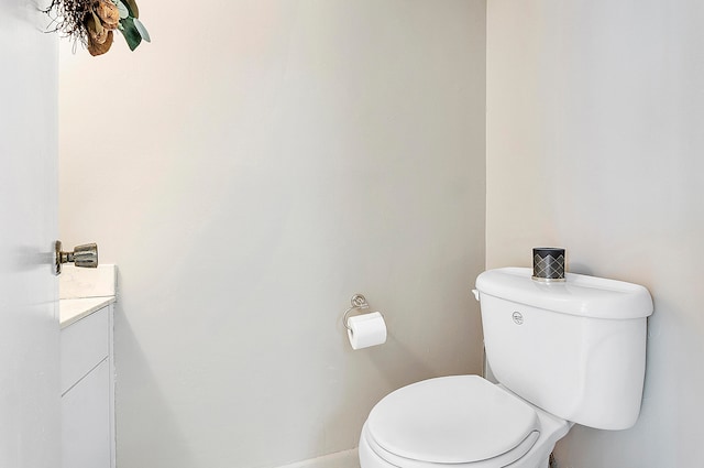 bathroom featuring toilet and vanity