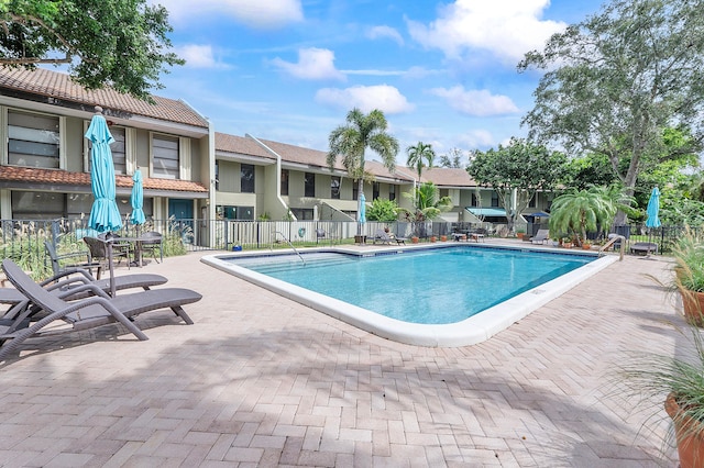 view of pool featuring a patio area