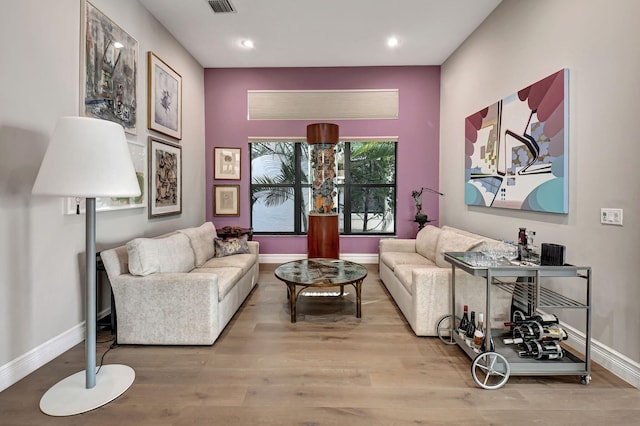 living room with light hardwood / wood-style flooring