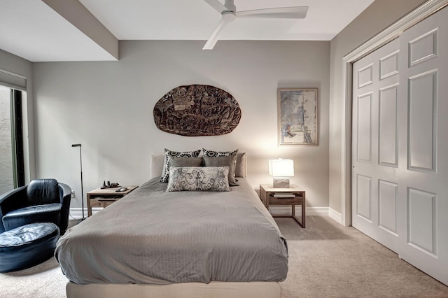 bedroom featuring light carpet, a closet, and ceiling fan