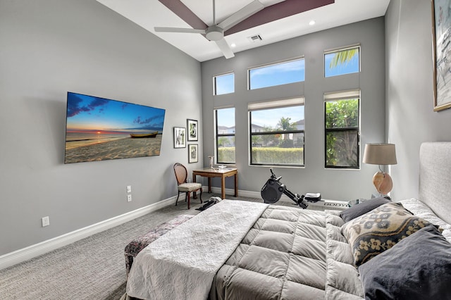 bedroom featuring ceiling fan, high vaulted ceiling, and carpet floors