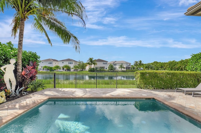 view of swimming pool with a water view