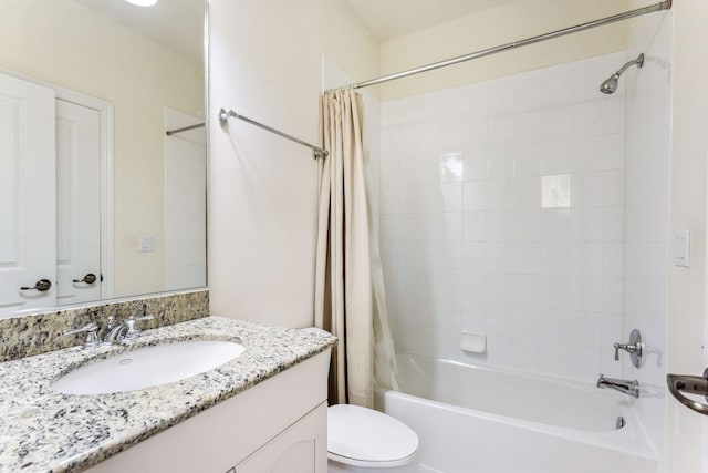 full bathroom featuring shower / bath combo, vanity, and toilet