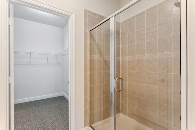 bathroom with a shower with shower door