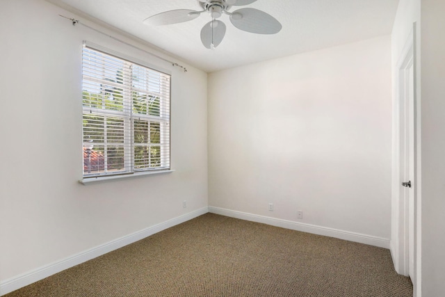 spare room with carpet flooring and ceiling fan