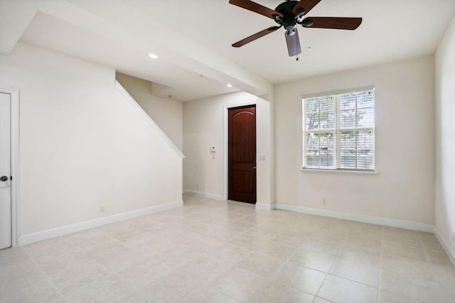 tiled empty room with ceiling fan