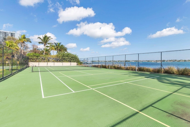 view of sport court featuring a water view