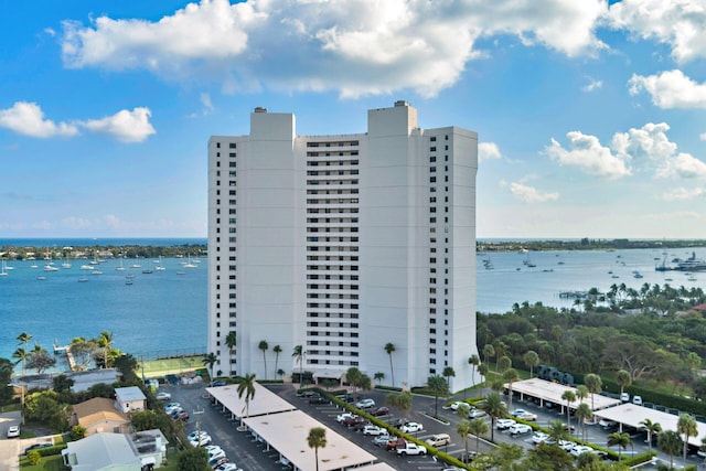 birds eye view of property with a water view