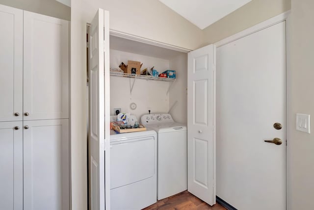 laundry room featuring washer and clothes dryer and hardwood / wood-style flooring