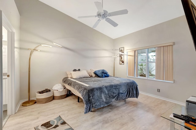 bedroom featuring vaulted ceiling, light hardwood / wood-style floors, and ceiling fan