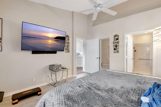 bedroom with light hardwood / wood-style flooring, connected bathroom, and ceiling fan