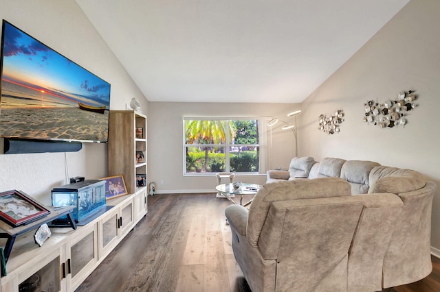 living room featuring vaulted ceiling and dark hardwood / wood-style flooring