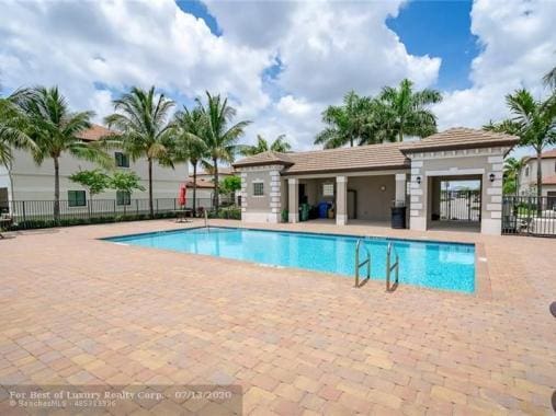 view of swimming pool with a patio