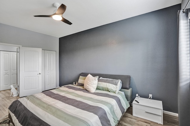 bedroom with wood-type flooring and ceiling fan