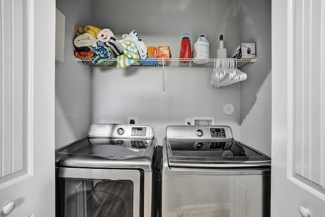 washroom featuring independent washer and dryer