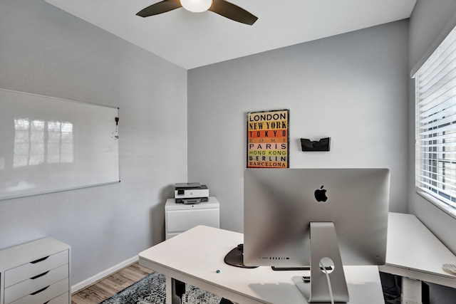 office area with ceiling fan and wood-type flooring