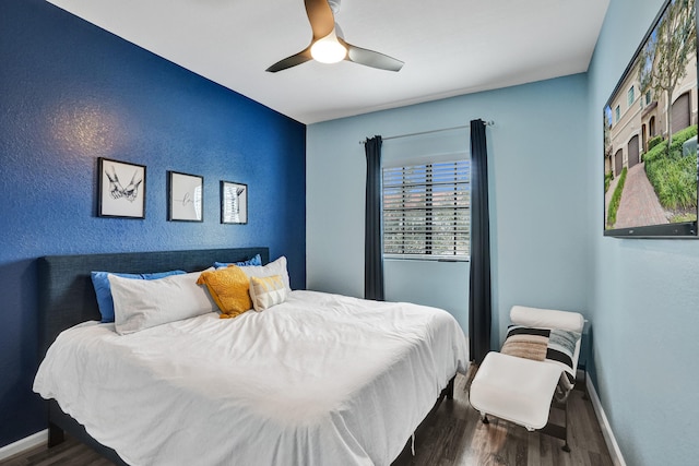 bedroom featuring hardwood / wood-style flooring and ceiling fan