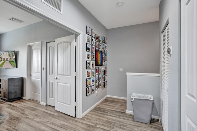 hallway featuring light hardwood / wood-style flooring