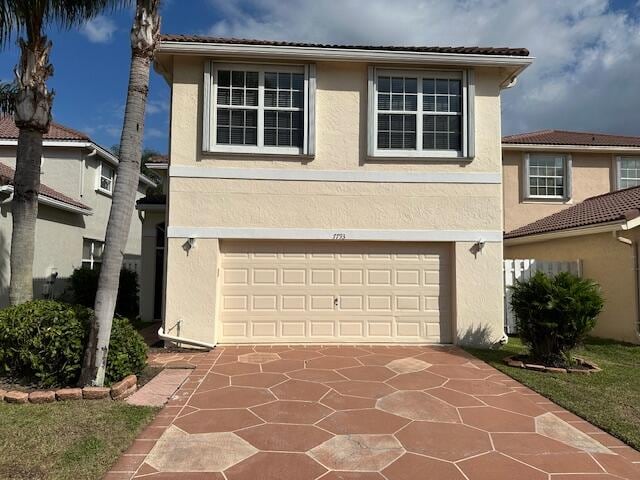 front facade with a garage