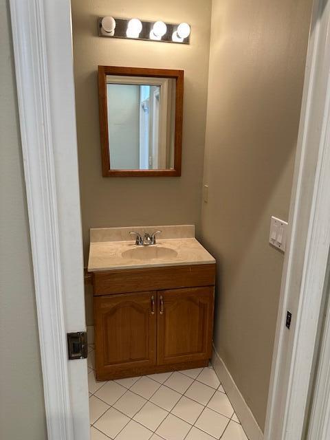 bathroom with vanity and tile patterned floors