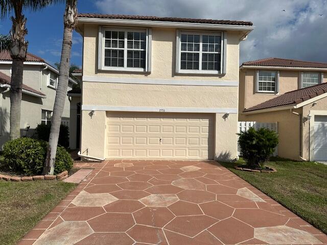 view of front of property with a garage