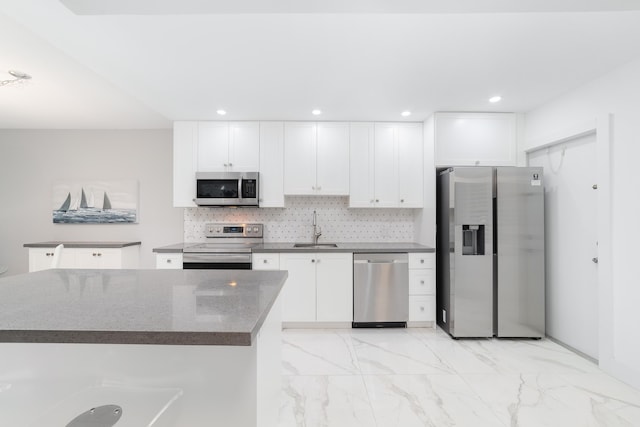 2801 N Palm Aire Dr Unit 106, Pompano Beach, FL 33069 - kitchen with white cabinetry, marble finish floor, appliances with stainless steel finishes, and a sink