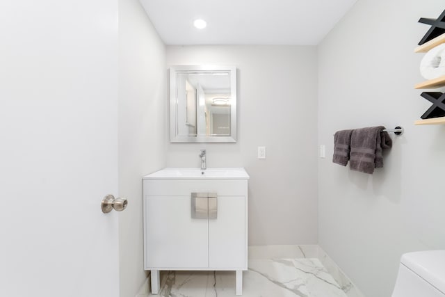 2801 N Palm Aire Dr Unit 106, Pompano Beach, FL 33069 - bathroom with toilet, baseboards, marble finish floor, vanity, and recessed lighting
