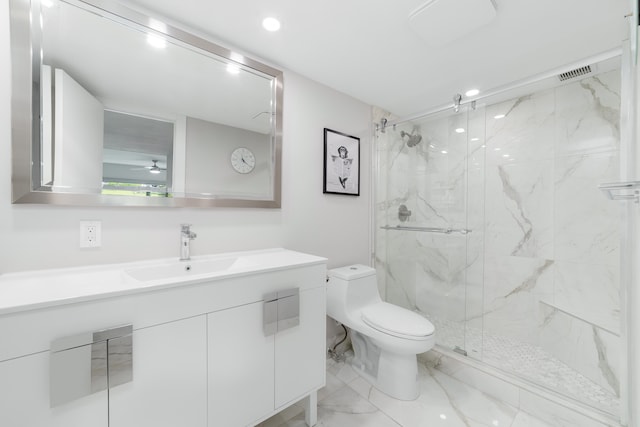 bathroom featuring vanity, toilet, an enclosed shower, and ceiling fan