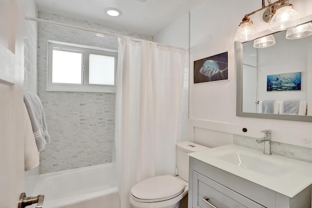 full bathroom featuring shower / bathtub combination with curtain, vanity, and toilet