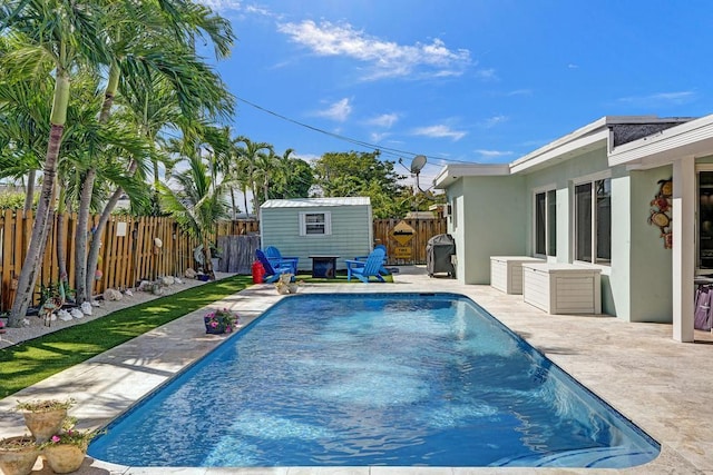 view of pool with an outdoor structure