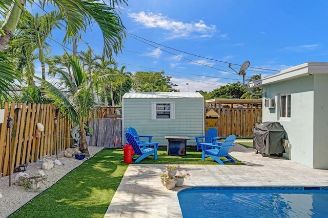 exterior space with a patio, a fenced in pool, and a shed