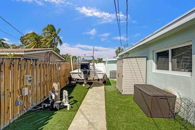 view of yard with a storage unit