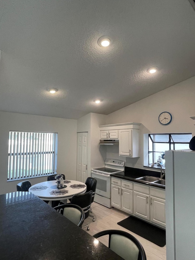 kitchen featuring white cabinets, a textured ceiling, white electric stove, and sink