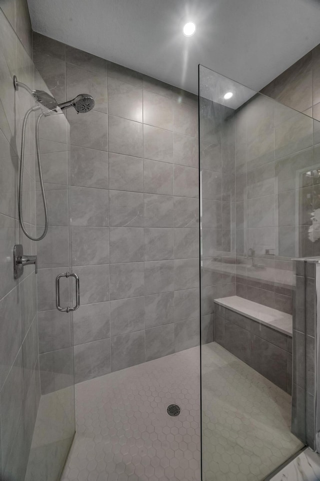 bathroom featuring an enclosed shower