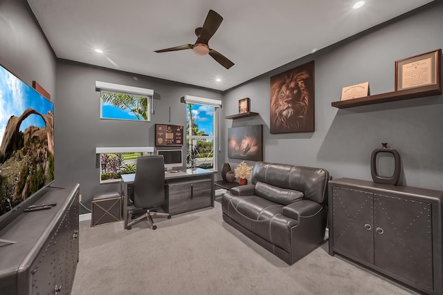 carpeted office featuring ceiling fan