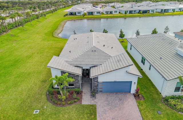 drone / aerial view featuring a water view