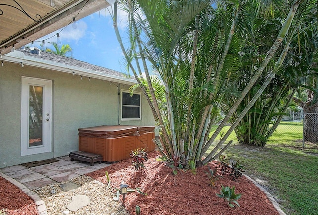 exterior space featuring a hot tub