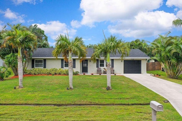 ranch-style house with a garage and a front yard