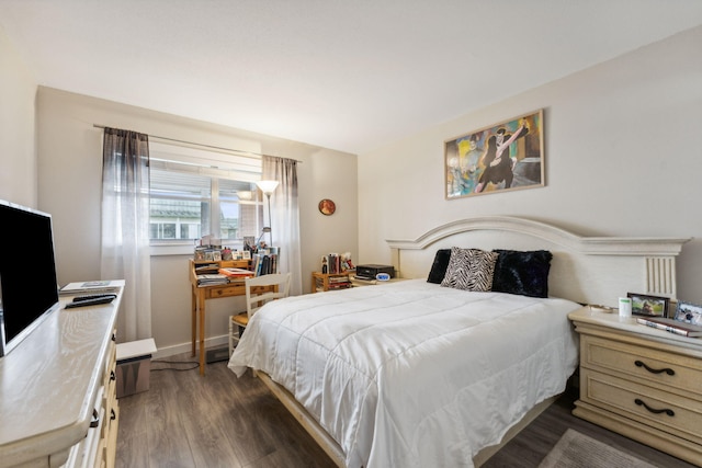 bedroom featuring dark hardwood / wood-style flooring