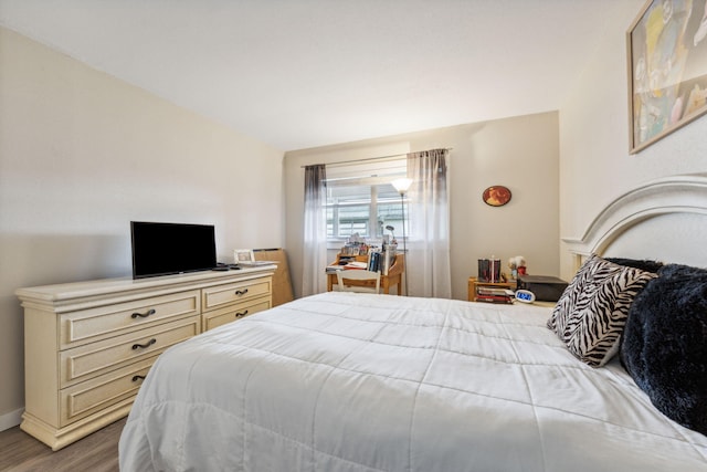 bedroom with wood-type flooring