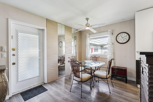 dining area featuring ceiling fan and hardwood / wood-style floors